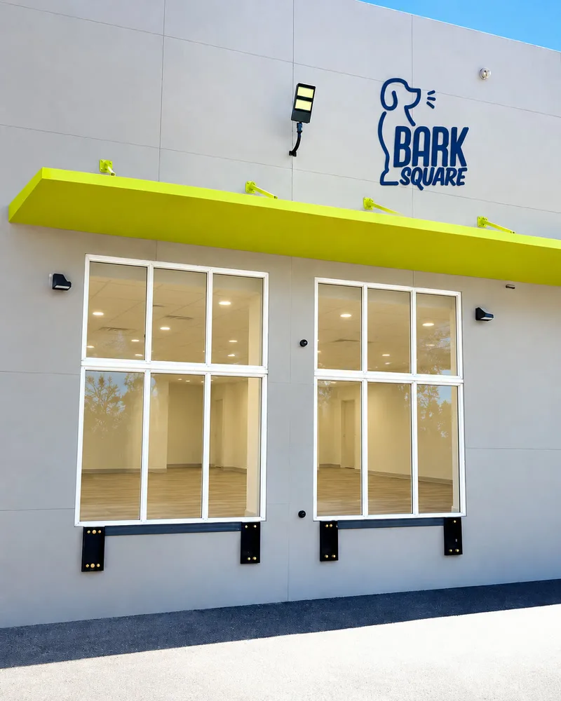 The same storefront with plain clear glass in the window frames and no graphics